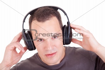 man listening music in headphones, isolated on white background, studio shot