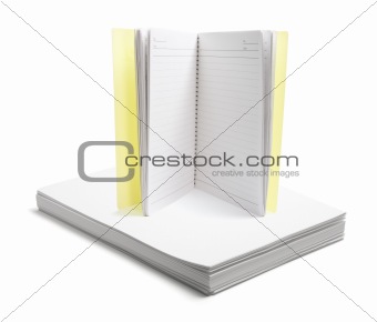Notebook on Stack of Papers
