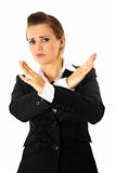 Frustrated modern business woman with crossed arms. Forbidden gesture.
