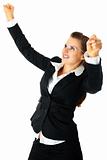 Excited modern business woman enjoying her success 
