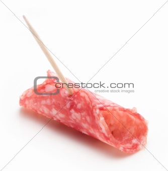Slice of Salami isolated over white
