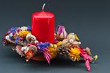 Decoration of  dry flowers with a red candle