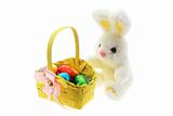 Easter Eggs in Basket with Easter Toy Bunny