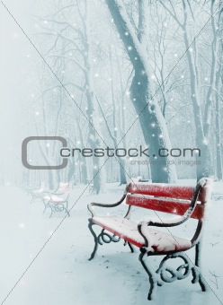 Red bench in the snow