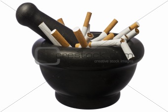 Quit smoking - pestle with cigarettes isolated over white