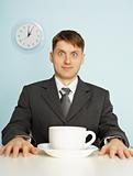 Businessman has drunk coffee and stare wide-eyes