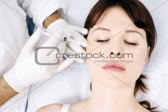 woman receiving an injection of botox from a doctor