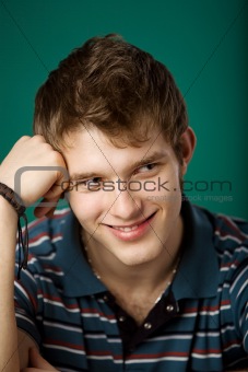 Young guy on a green background