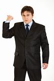 Angry businessman showing get out gesture
