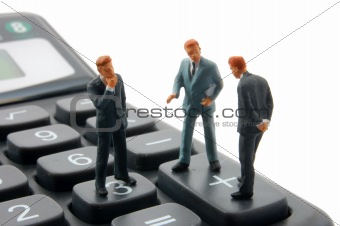 toy business man on calculator isolated 