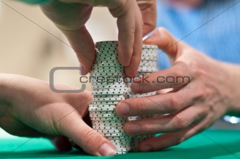 Hands Stacking Poker Chips