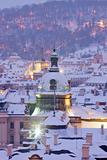 prague - winter view of lesser town rooftops covered with snow 