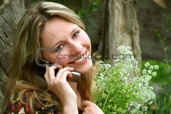 The beautiful rural girl with the mobile telephone