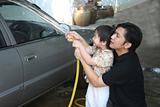 Man & kid washing car