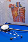 Stethoscope and a medical book