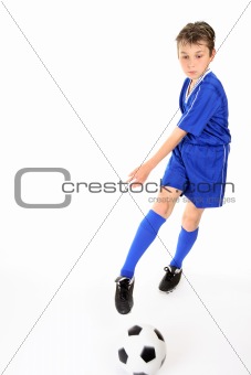 Child kicking ball