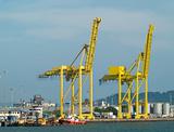 Two container cranes in a harbour