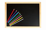 Chalkboard and multicolored pencils