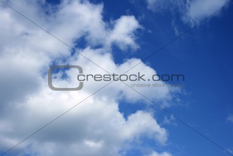 White clouds in the blue sky.