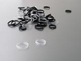 Black and White rubber bands on gray background