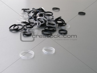 Black and White rubber bands on gray background