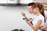The couple cooks food