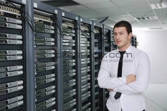 young engeneer in datacenter server room