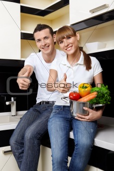 Smiling couple on kitchen