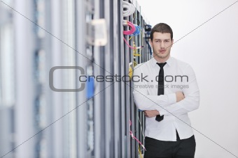 young engeneer in datacenter server room