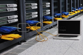 laptop computer at server network room