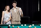 The couple plays billiards