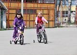 happy childrens group learning to drive bicycle