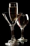 Champagne, wine and martini glasses isolated on black