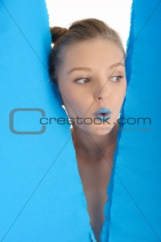 Young woman with blue sheet of paper