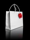 White paper bag and red bow