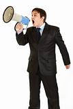 Frustrated young businessman yelling through megaphone
