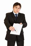 Serious modern businessman with documents and pen for your signing
