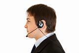 Thoughtful  modern businessman with headset. 
