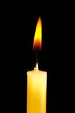 Yellow  candle in dark room