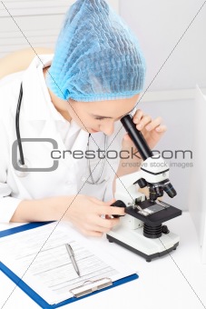Medical - Female Nurse Looking In Microscope