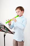 Little boy playing flute