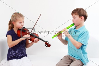 Kids playing flute and violin