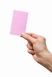 hand holding a pink sheet of paper
