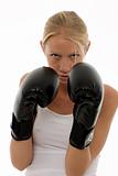 portrait of a young caucasian woman who does kick boxing with boxing gloves