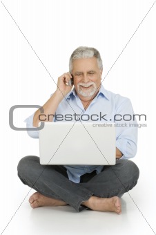 elderly man using laptop