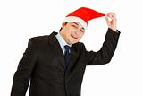 Happy young businessman in hat of Santa Claus. Happy New Year and Merry Christmas!
