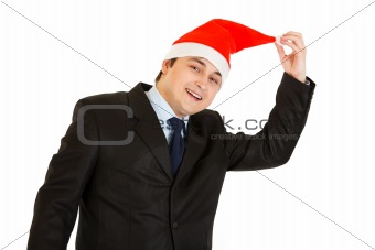 Happy young businessman in hat of Santa Claus. Happy New Year and Merry Christmas!
