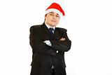 Pleased young businessman in hat of Santa Claus. Happy New Year and Merry Christmas!
