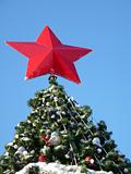 Red Star on top of the tree. Christmas decoration 