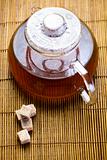 Glass teapot of tea